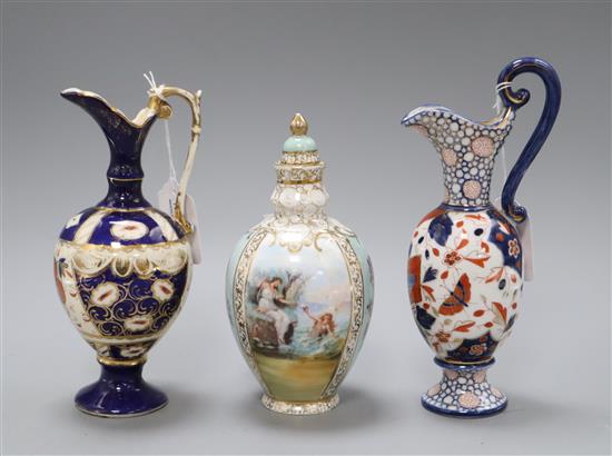 A Helena Wolfsohn style ovoid jar and cover, two Imari-patterned ewers and a pair of floral-decorated cabinet plates